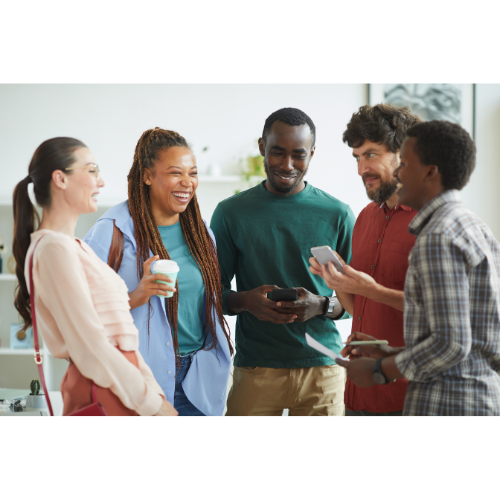 Diverse group of people smiling and talking with one another.