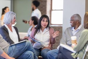 Group of people talking with one another