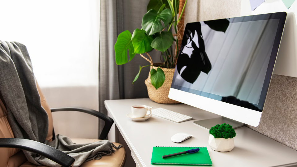 Desk with a computer and empty chair