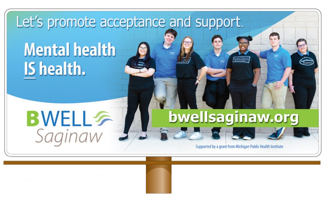 BWell Saginaw mental health awareness and stigma reduction billboard that says, "Let's promote acceptance and support. Mental health is health. BWell Saginaw. BWellSaginaw.org Supported by a grant from Michigan Public Health Institute